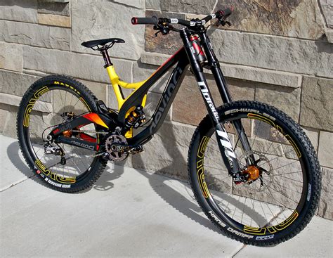 Devinci bikes - The 2020 Devinci Wilson 29 GX DH is an Downhill Carbon mountain bike. It sports 29" wheels, is priced at $4,498 USD, comes in a range of sizes, including SM (Low, High), MD (Low, High), LG (Low, High), XL (Low, High), has RockShox suspension and a SRAM drivetrain. The bike is part of Devinci 's Wilson range of mountain bikes.